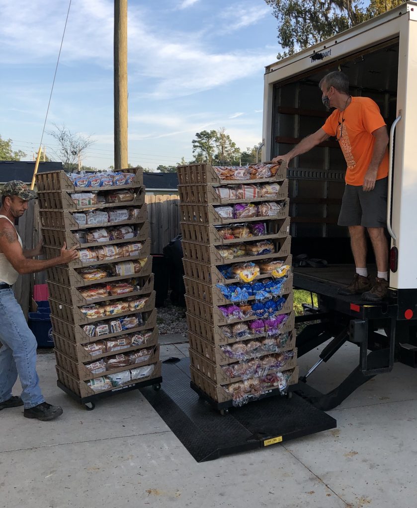 Volunteers unloading our truck.